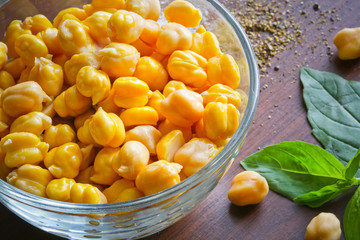 chickpeas  on the wooden surface and basil