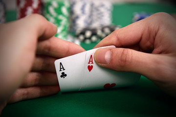 poker player with two Aces