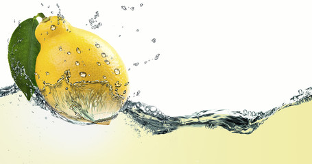 Ripe citrus lemon,amid a spray of juice.