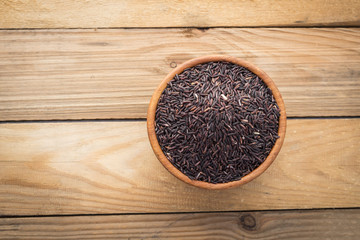 Rice berry in wooden bowl