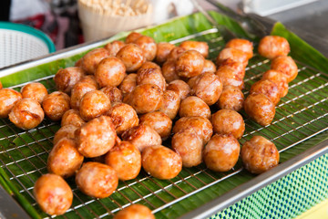 fried meatballs sale at street market