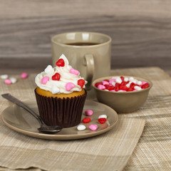 Valentine cupcakes with frosting and hearts. Selective focus.