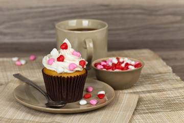 Valentine cupcakes with frosting and hearts. Selective focus.