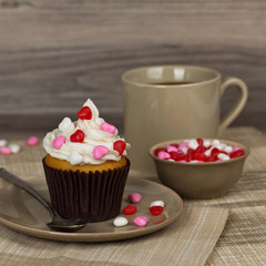 Valentine cupcakes with frosting and hearts. Selective focus.