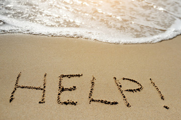 help written on sand beach