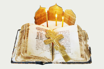 Orthodox Christian still life with open ancient book and cross