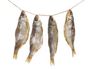 Fotobehang vier heerlijke gedroogde visjes © Ekaterina Andreeva