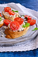 Sandwich with cheese, tomato and Basil