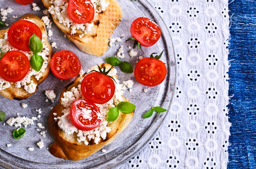 Sandwich with cheese, tomato and Basil