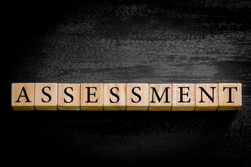 Word ASSESSMENT isolated on black background
