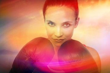 Close-up portrait of a determined female boxe