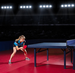 Girl table tennis player at sports hall