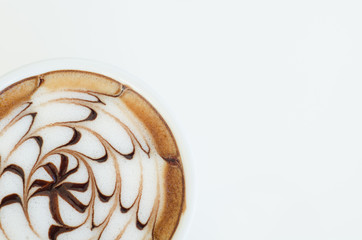 a cup of latte art on white background