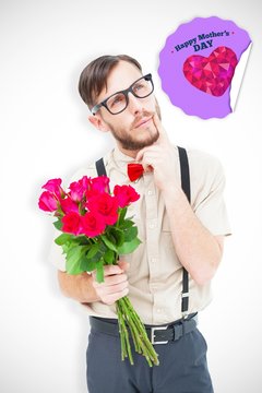 Composite image of geeky hipster offering bunch of roses