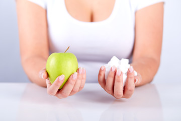 Woman is holding a sugar cubes