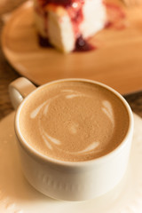 a cup of coffee with crepe cake, selective focus.