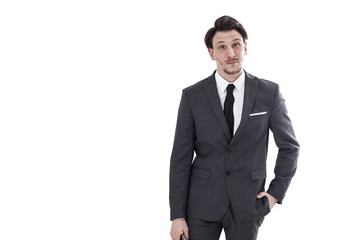 Businessman looking and smiling with hand in pocket