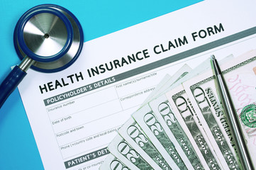Health insurance claim form with money