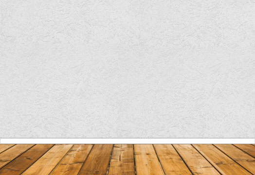 Textured white wall with wooden floor panels