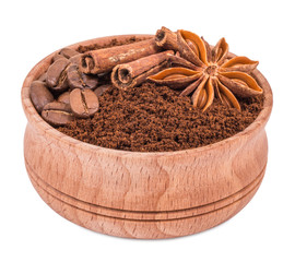 ground coffee in a wooden bowl isolated on white background