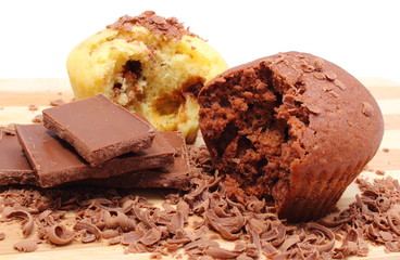 Fresh baked muffins, grated and portion of chocolate
