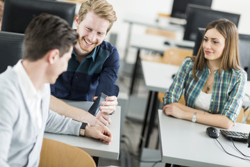 Young students talking in a classroom