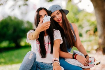 two beautiful girls rest on the street