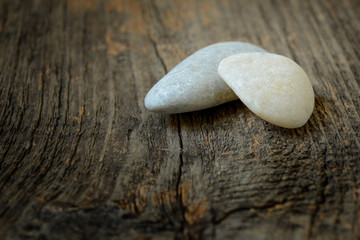 Stones isolated on wood background