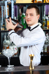 Barman makes tasty cocktails