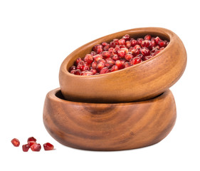 Pomegranate seeds in a bamboo cup