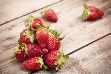 Fresh ripe strawberries on wooden background