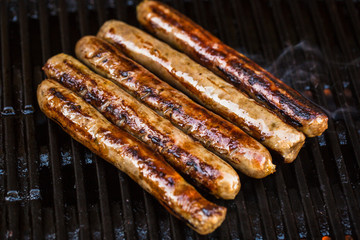 Barbecued beef sausages on grill