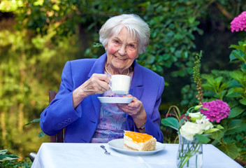 Happy Senior Woman in Coffee Time at the Garden.