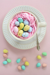 Fototapeta na wymiar Mini Easter eggs in cup in vertical format