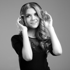 Beautiful smiling woman listening to music
