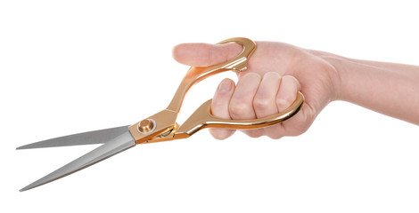 Female hand with scissors isolated on white