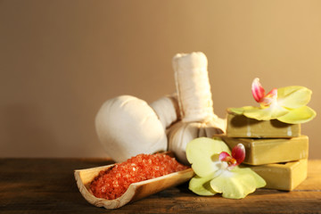 Spa still life on wooden table on brown background