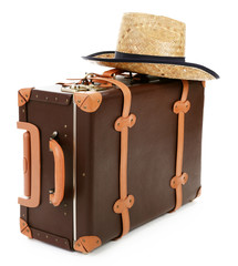 Suitcase and straw hat isolated on white
