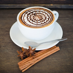 latte art coffee on wooden background