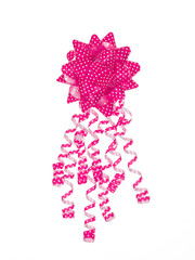 Dotted pink gift bow isolated on white background