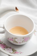 Obraz na płótnie Canvas Tea being poured into tea cup
