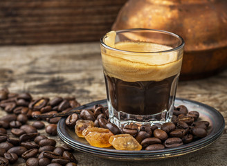 cup of coffee in vintage with caramel brown sugar crystals