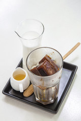 Iced coffee cubes with milk and sirup