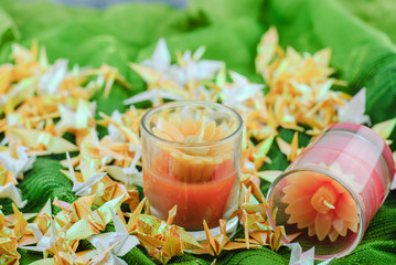 Candles on green fabric