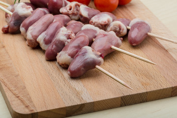 Raw chicken hearts for barbecue