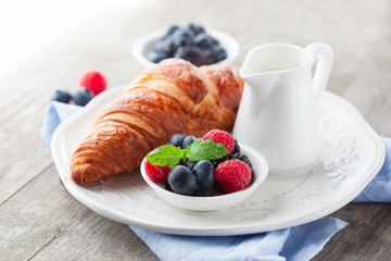 Fresh croissant and berries