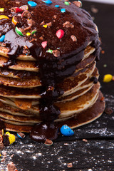 Stack of delicious pancakes with chocolate