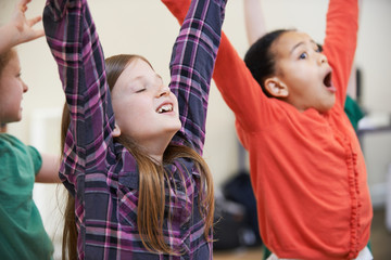 Group Of Children Enjoying Drama Class Together