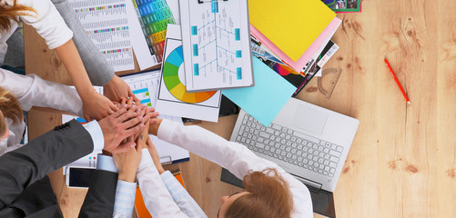 Business team with hands together - teamwork concepts