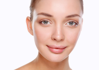 Fototapeta premium Close up portrait of beautiful young woman face. Isolated on